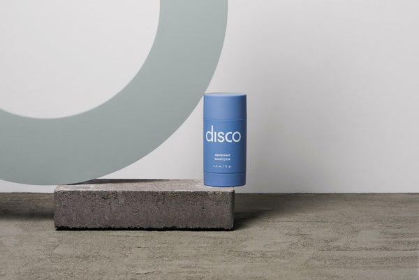 men's eucalyptus deodorant balancing on a concrete brick